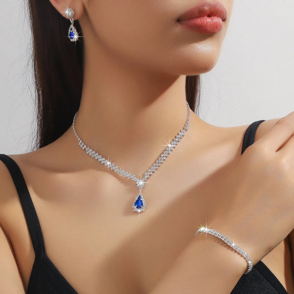 Claw chain necklace and earrings set with drop-shaped rhinestones in choice of five colours