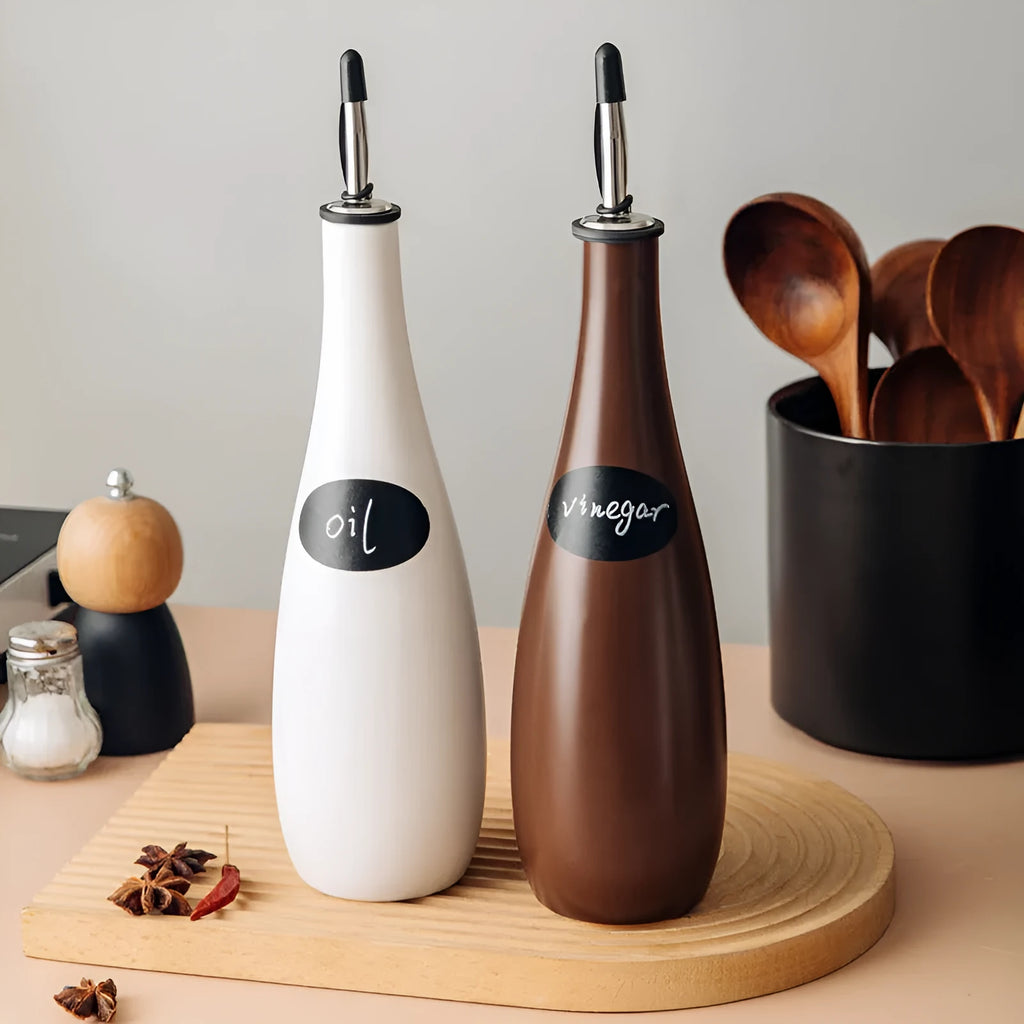 Ceramic oil pot with stainless steel funnel in black, coffee brown, or white finish.