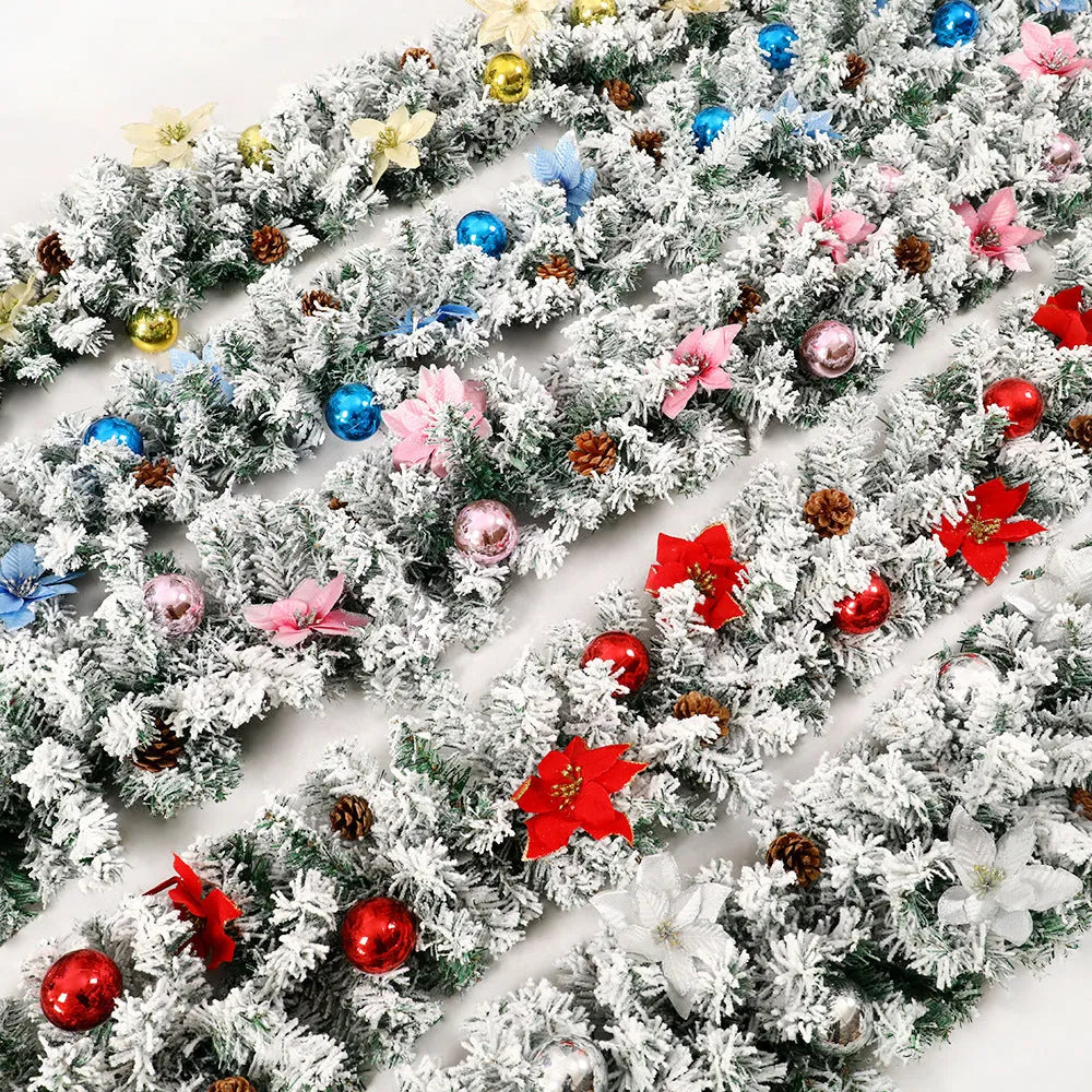 Christmas rattan garland decoration with flocked texture in five colour options displayed draped