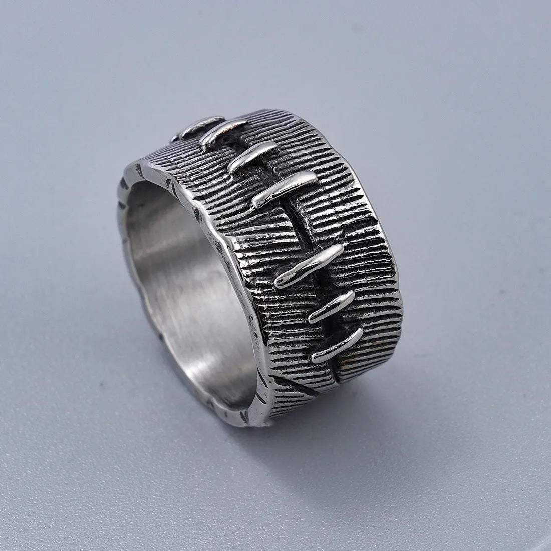 Dark punk style titanium steel ring with stitched geometric U-shape double ring design in retro colour.