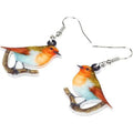 A pair of women's acrylic pendant earrings with a detailed Blue Titmouse bird design in a geometric style.