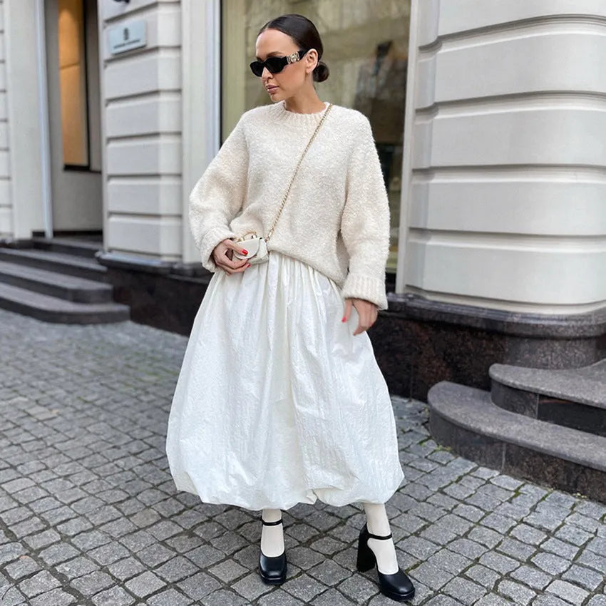Women's cotton long skirt in solid white colour showing front view and length