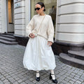 Women's cotton long skirt in solid white colour showing front view and length