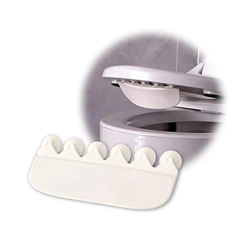 White PVC children's toilet training splash guard placed on a toilet seat.