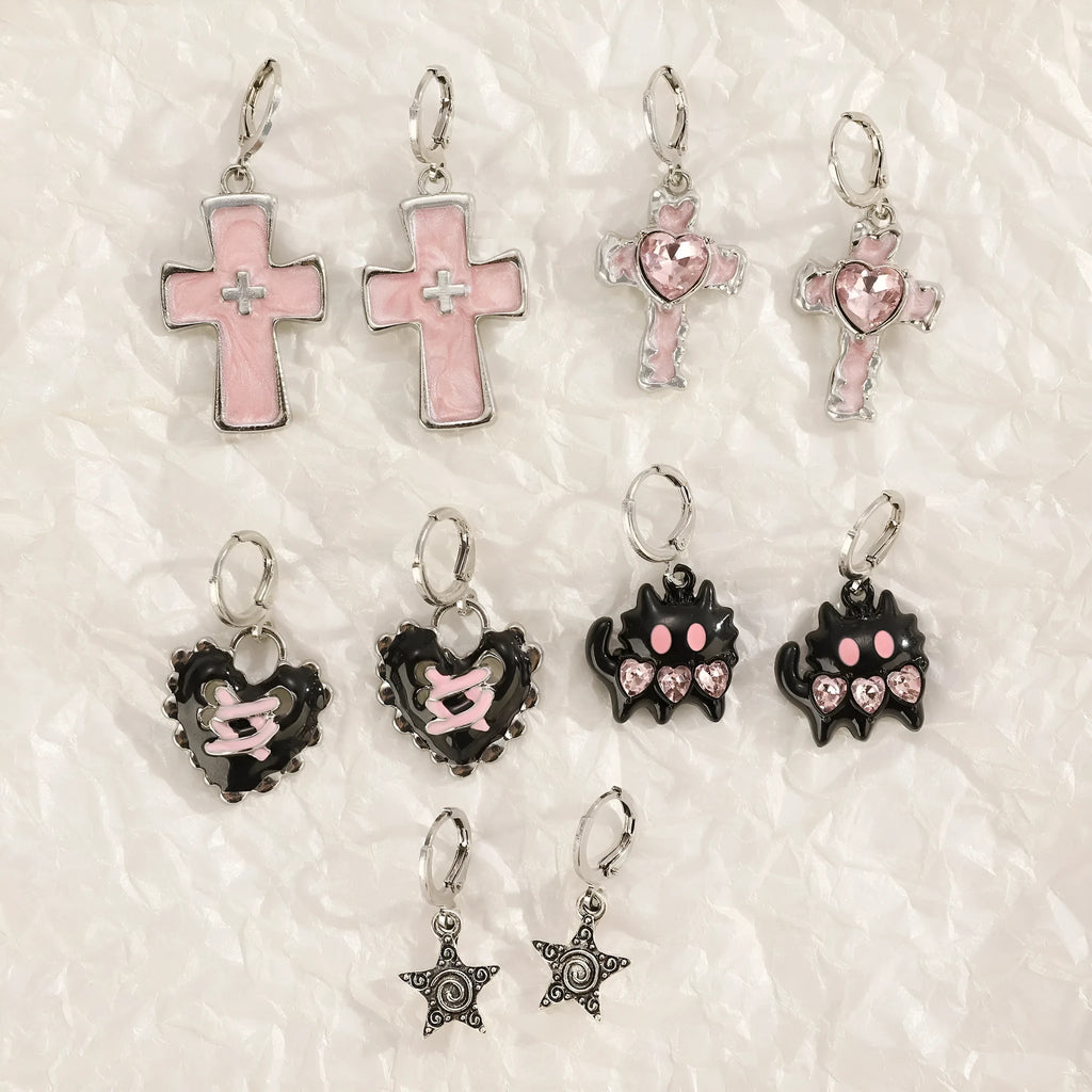 Women's alloy earrings with cross and heart designs in white and antique silver colour variants