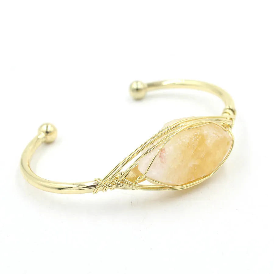 Natural raw gemstone bracelet with winding crystal design showing 8mm stones in various colours