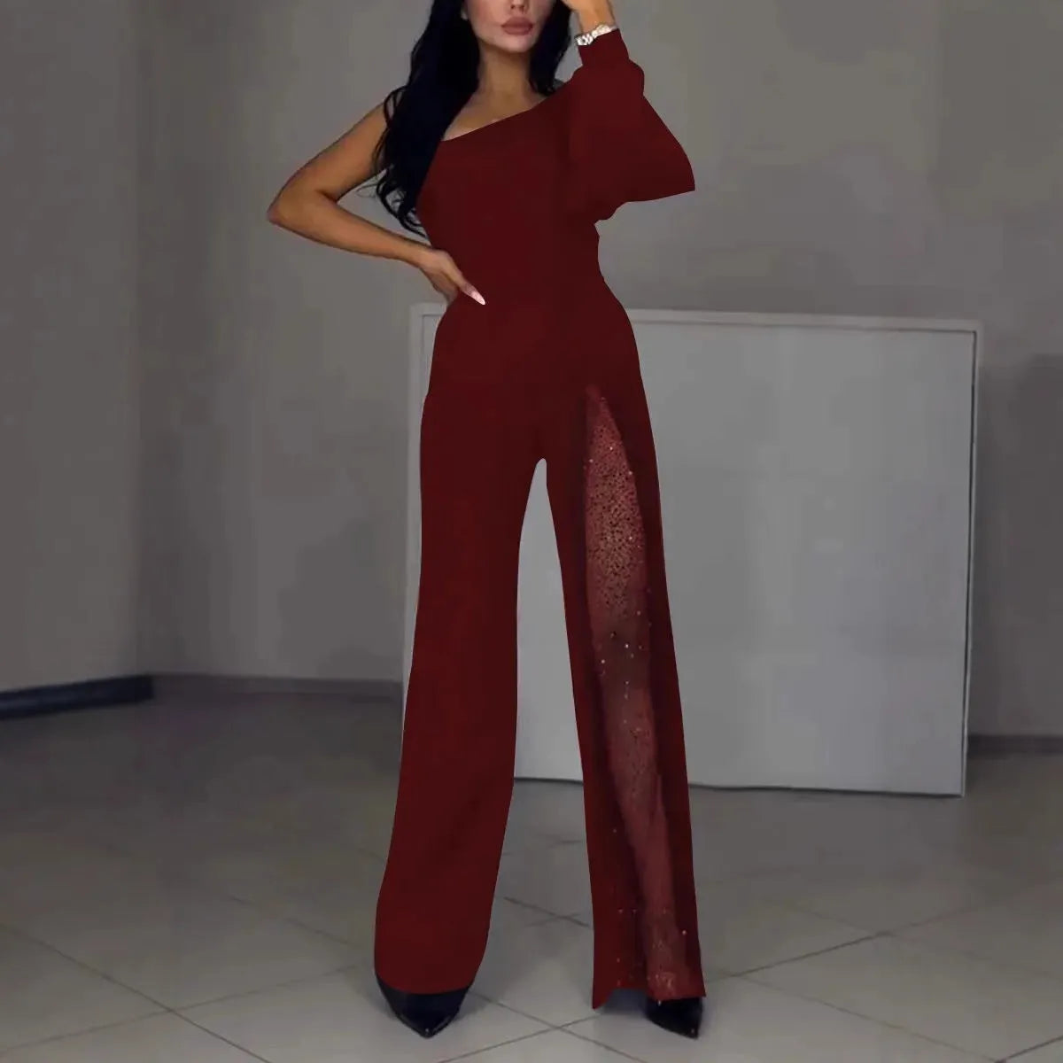 Women's black oblique shoulder jumpsuit with high slit detail and long sleeves
