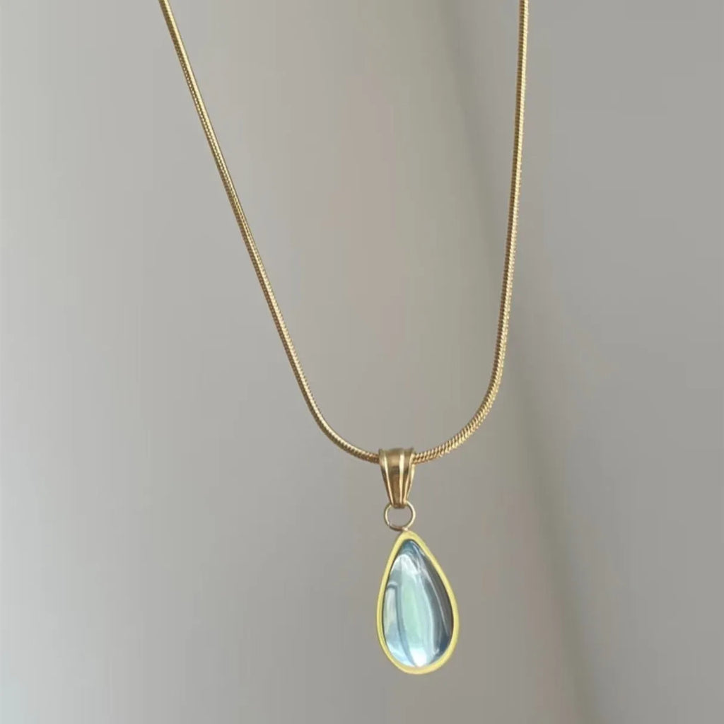 Retro titanium steel necklace with a blue or green water drop pendant featuring a mixed gem inlay.