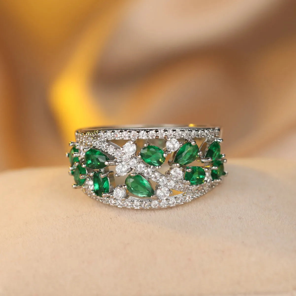 Women's hollow round fashion ring in gold or platinum finish with blue or white accents on a copper band.