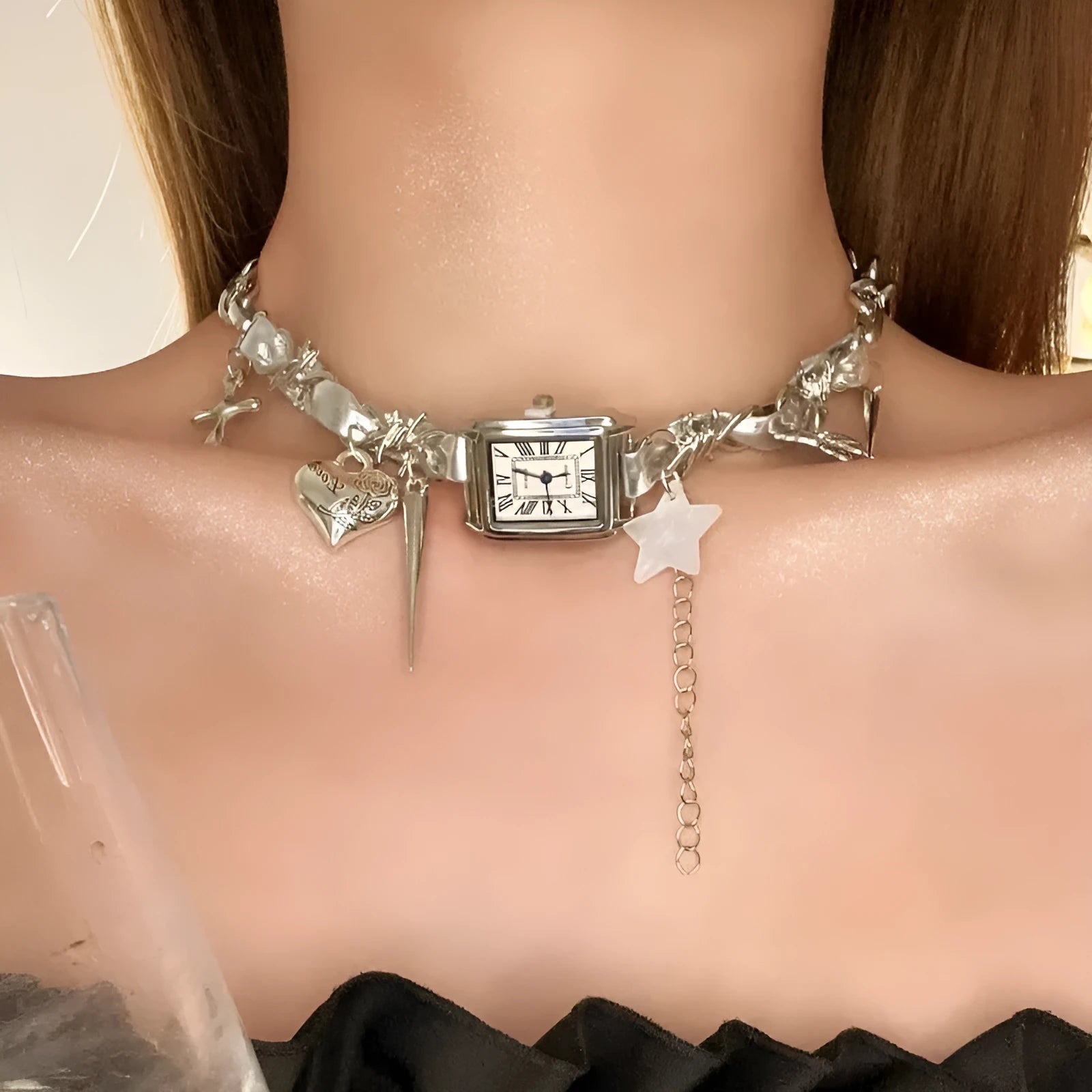 Dark electroplated women's necklace with layered chains, cross pendant, and adjustable length