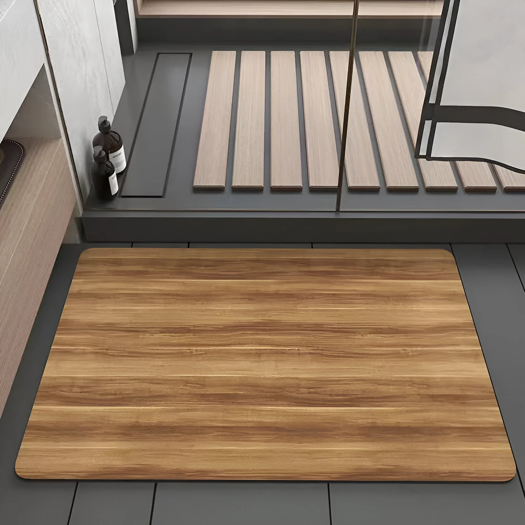 Square diatomite bathroom floor mat with geometric wood grain pattern, shown in a washroom setting.