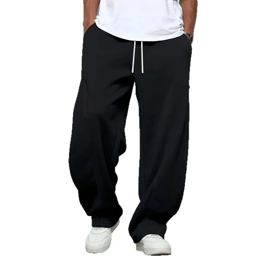 Men's solid colour casual trousers with an elastic waistband and straight leg in a grey shade.
