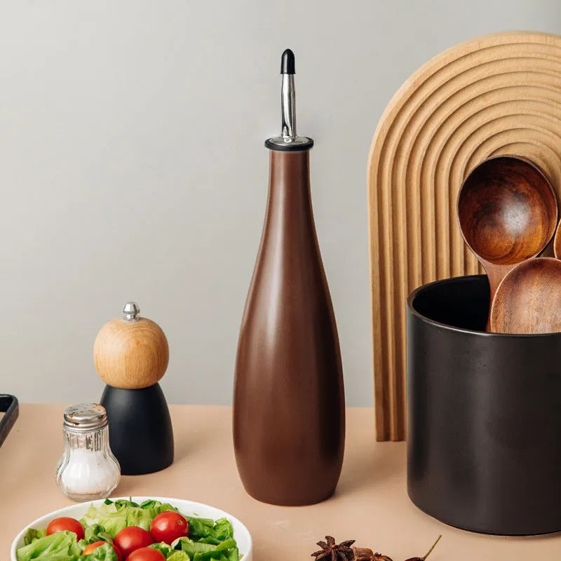 Ceramic oil pot with stainless steel funnel in black, coffee brown, or white finish.