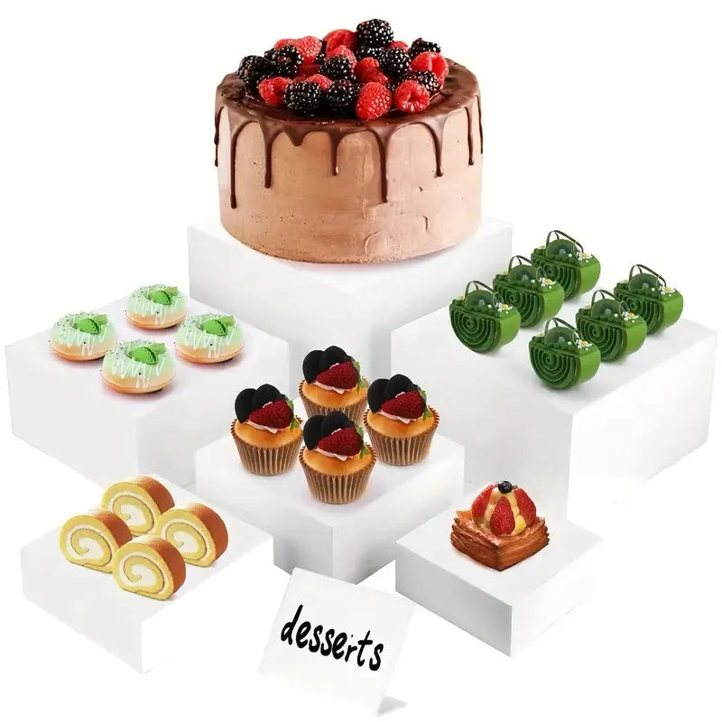 White plastic cube dessert display stand with six individual pieces for cake and confectionery presentation