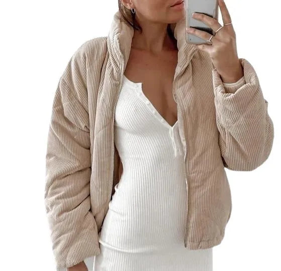 Apricot coloured women's corduroy jacket with stand collar and front zip, showing textured fabric.