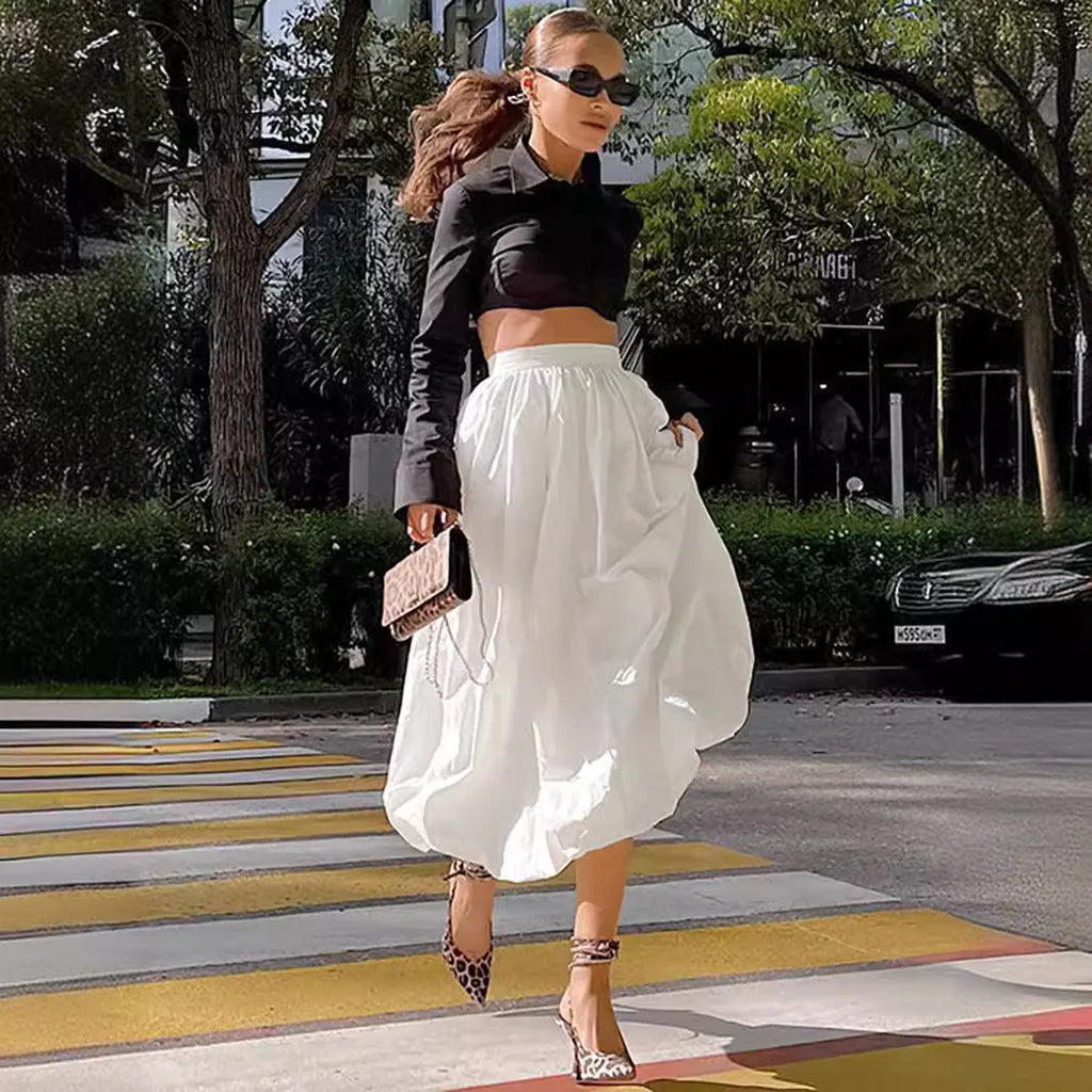 Women's cotton long skirt in solid white colour showing front view and length