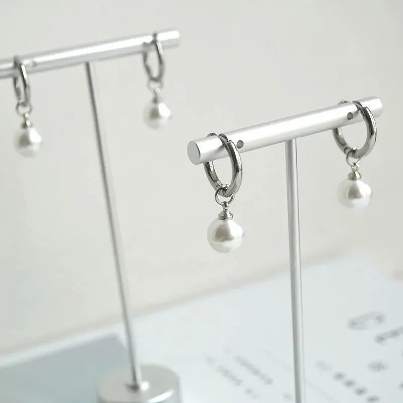 Geometric alloy pearl drop earrings with titanium steel posts and round pearl decorative elements