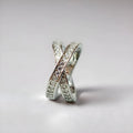 Simple geometric copper cross ring with micro-inlaid zircon stones in silver or rose gold finish.