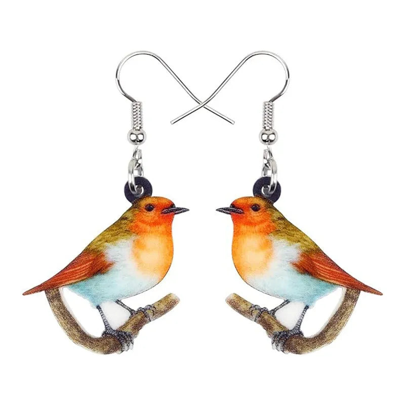 A pair of women's acrylic pendant earrings with a detailed Blue Titmouse bird design in a geometric style.