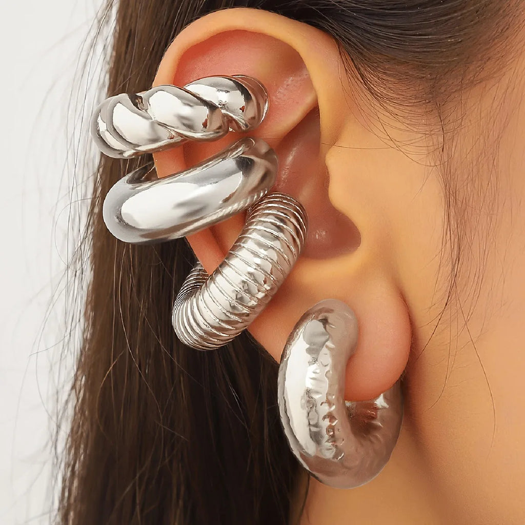 Set of four geometric non-pierced ear clips in gold and silver colours