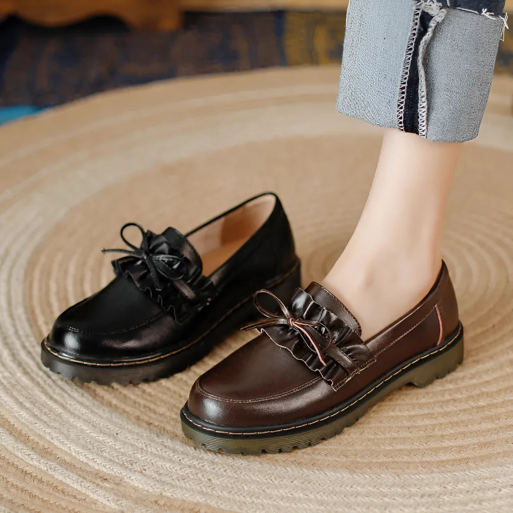Women's black leather ankle boots with round toe and chunky flat heel, British style