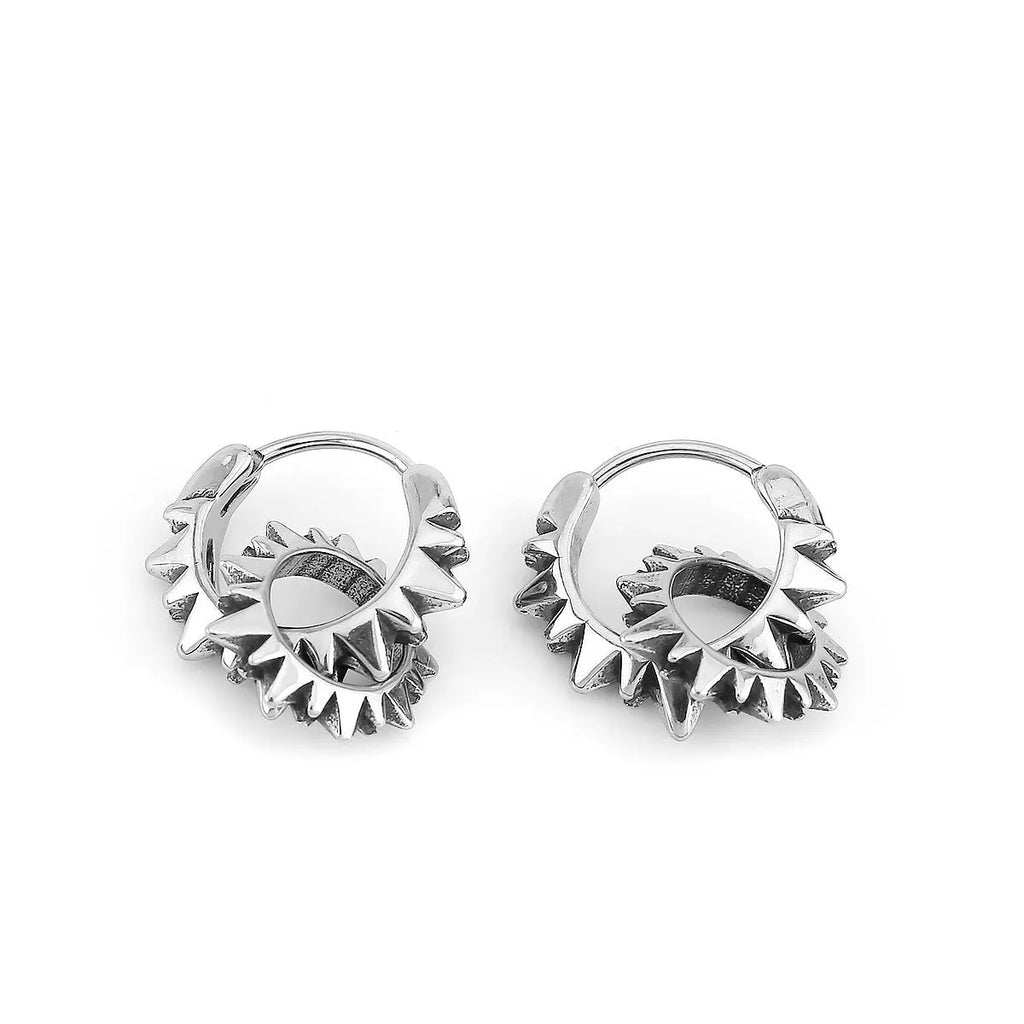 A pair of polished stainless steel round hoop earrings with a titanium steel finish in a steel colour.