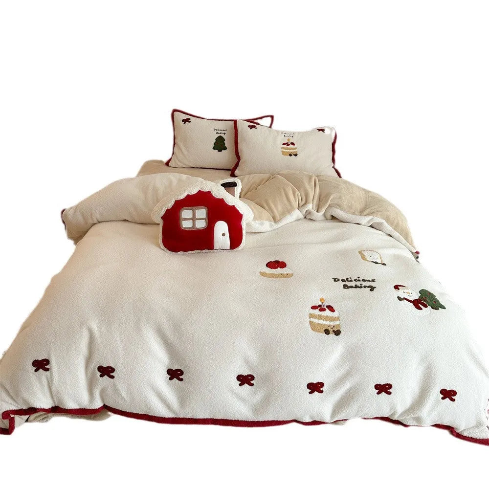 Winter Christmas cartoon patterned bed linen four-piece set on a bed, showing duvet cover and pillowcases.