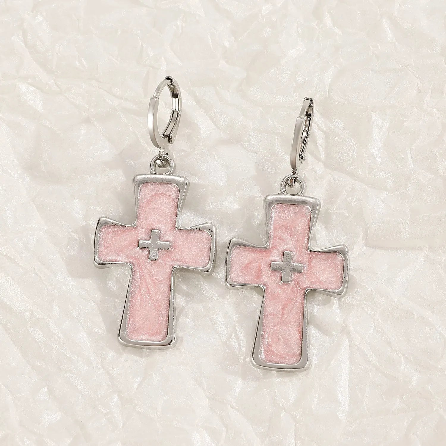 Women's alloy earrings with cross and heart designs in white and antique silver colour variants