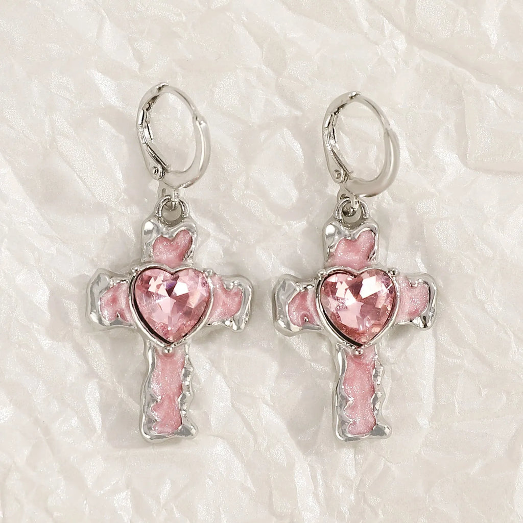 Women's alloy earrings with cross and heart designs in white and antique silver colour variants