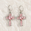 Women's alloy earrings with cross and heart designs in white and antique silver colour variants