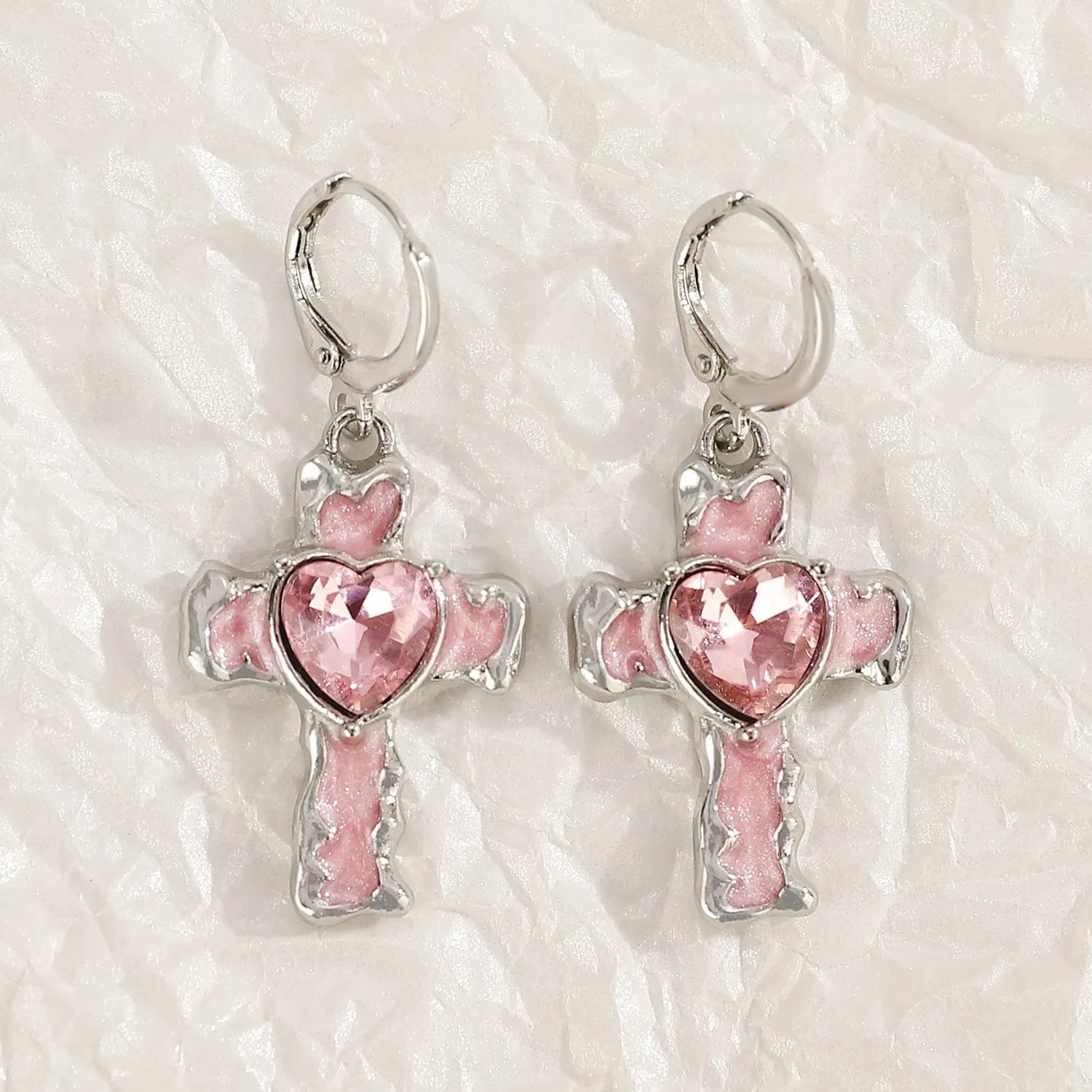 Women's alloy earrings with cross and heart designs in white and antique silver colour variants