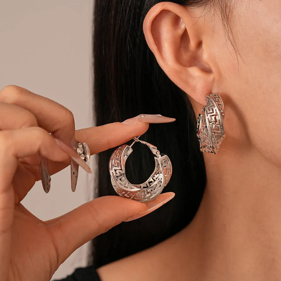 Women's geometric twisted round hollow stud earrings in silver needle-gold or silver needle-silver finish