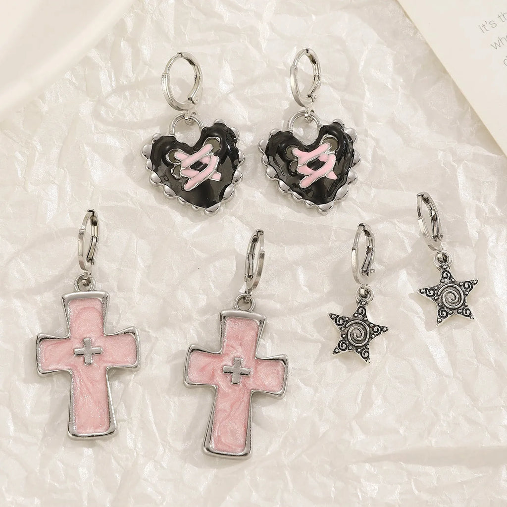 Women's alloy earrings with cross and heart designs in white and antique silver colour variants