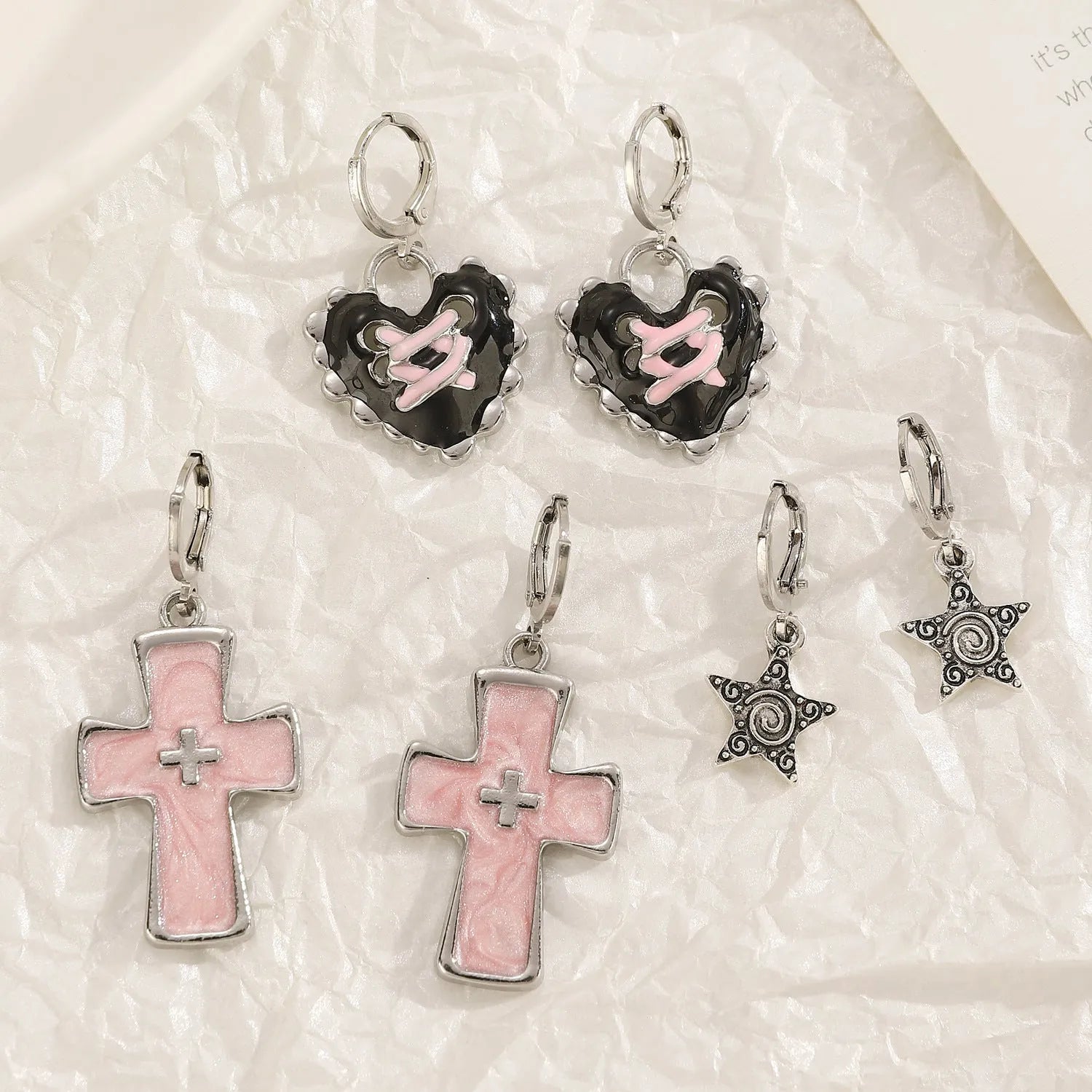 Women's alloy earrings with cross and heart designs in white and antique silver colour variants