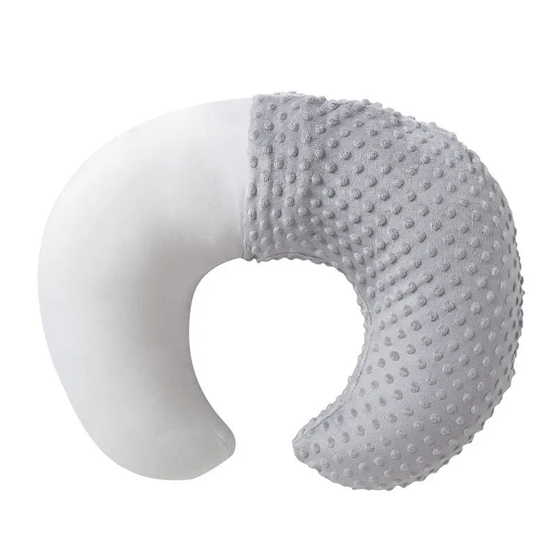 Nursing pillow with integrated spill barrier in a choice of pink, yellow, grey, or light blue colours.
