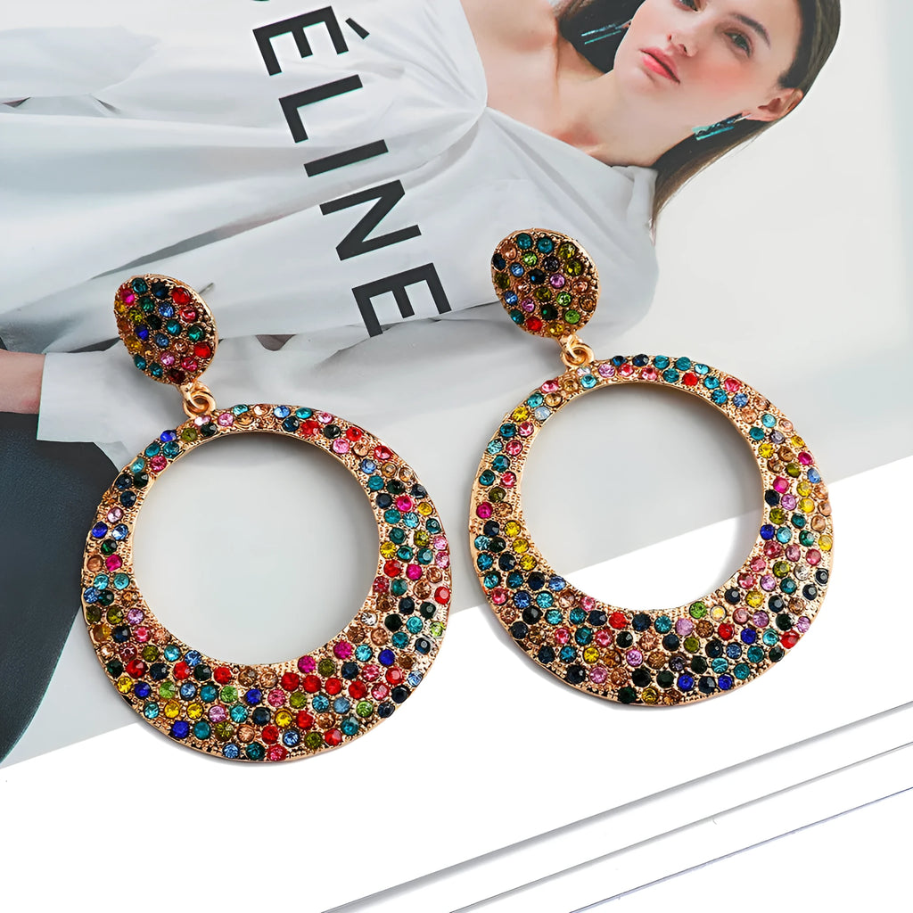 Colourful metal pendant earrings with diamond accents and cartoon style design