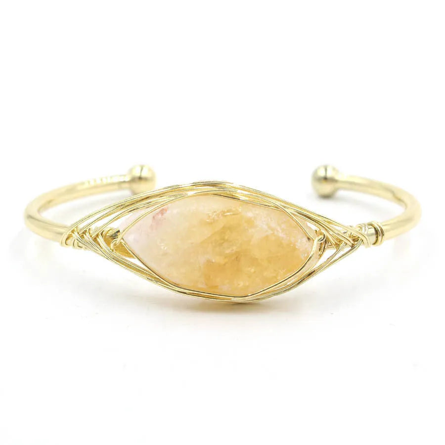 Natural raw gemstone bracelet with winding crystal design showing 8mm stones in various colours