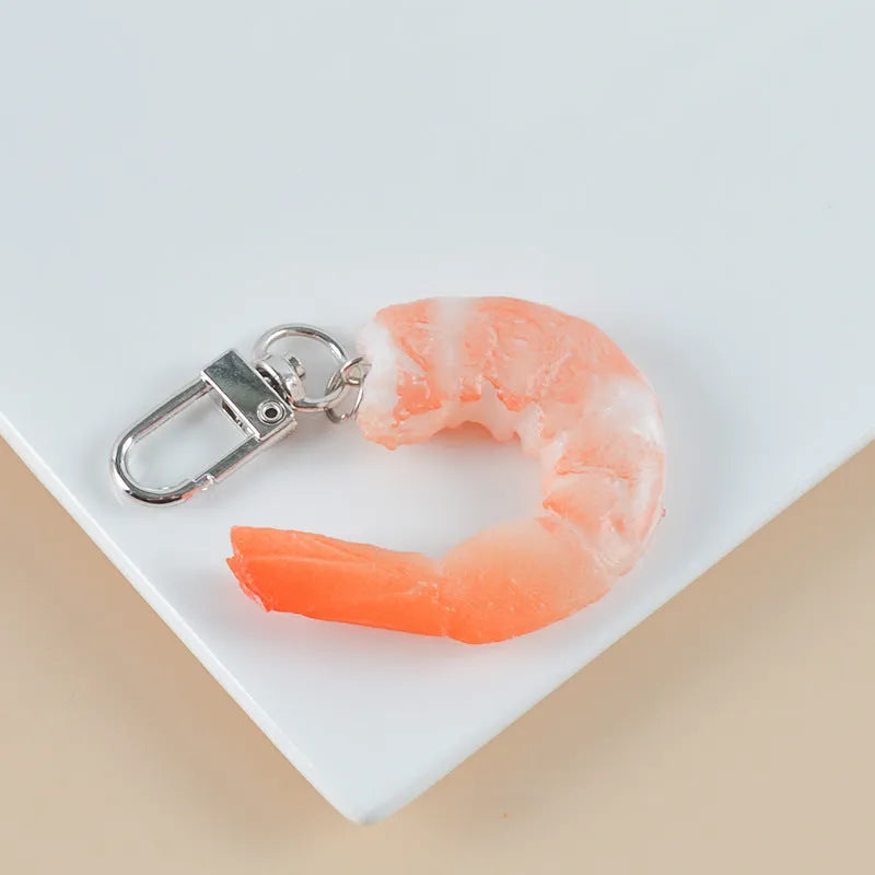 PVC injection moulded shrimp-shaped keychain with door buckle, 1.5cm thick.