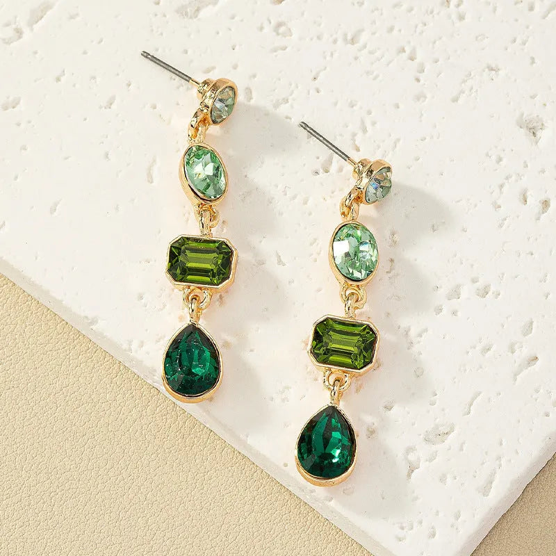 Women's geometric water drop rhinestone ear studs in royal blue alloy with silver tone setting