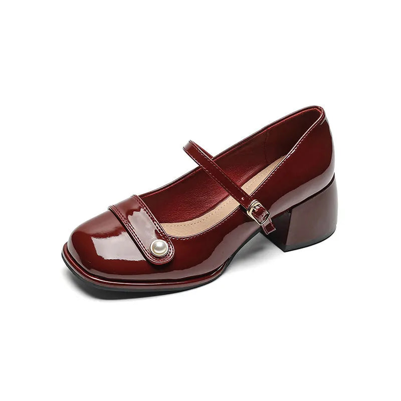 French-style chunky heel hiking pumps in patent leather with square toe and buckle