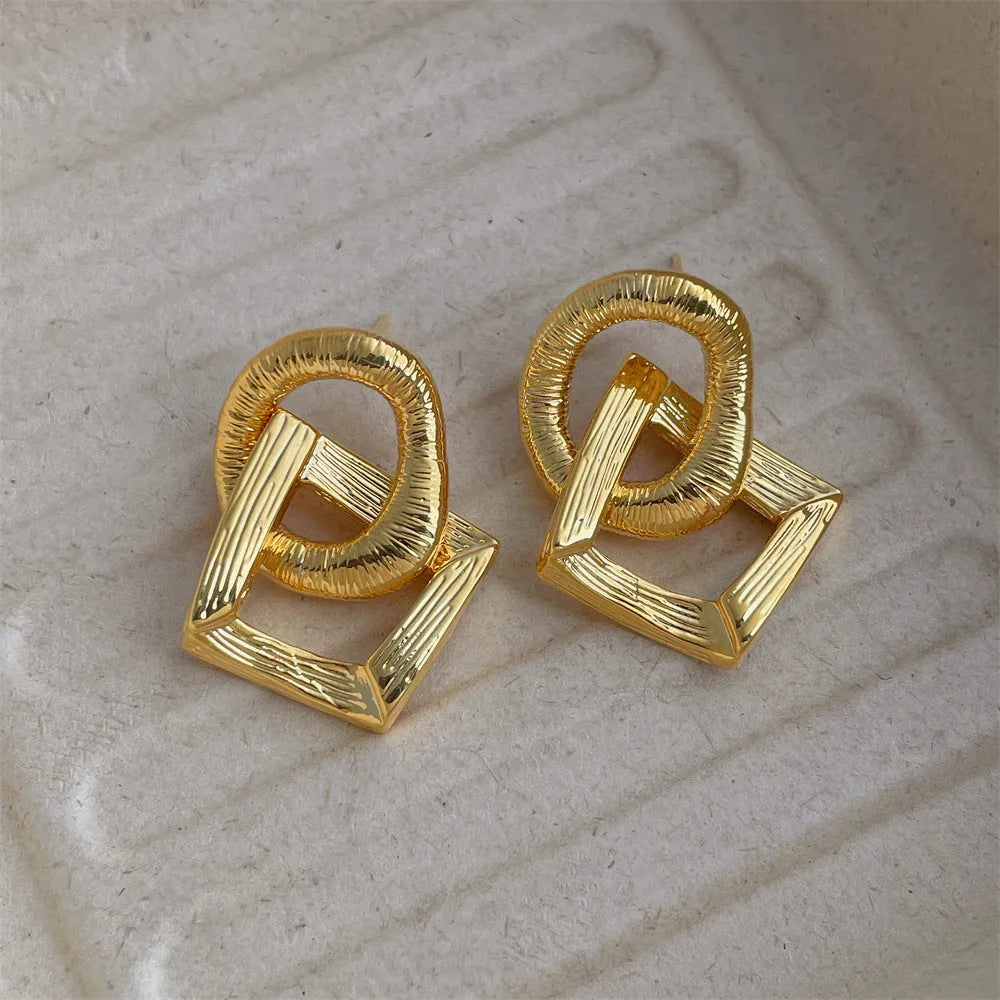 Retro geometric circle pendant earrings with 3.4 cm drop in electroplated gold or silver finish