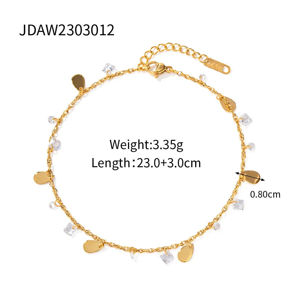 Silver stainless steel women's anklet with geometric and water drop tassel charms.