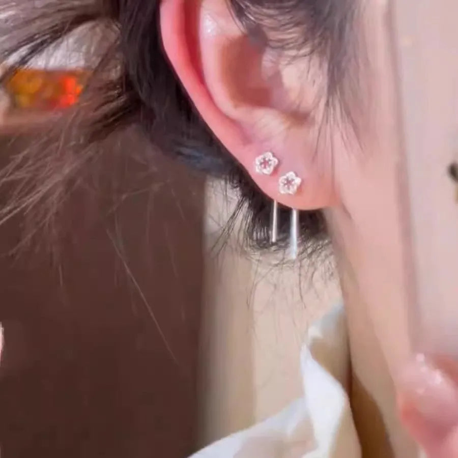 Sterling silver needle hollow flower hanging earrings with silver petal stud design