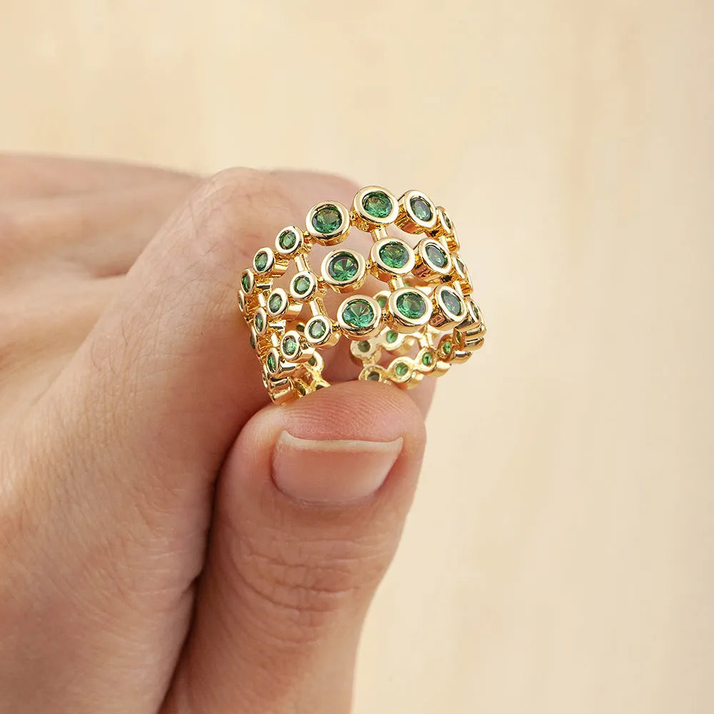 Wide copper ring with green zircon stones and gold plating