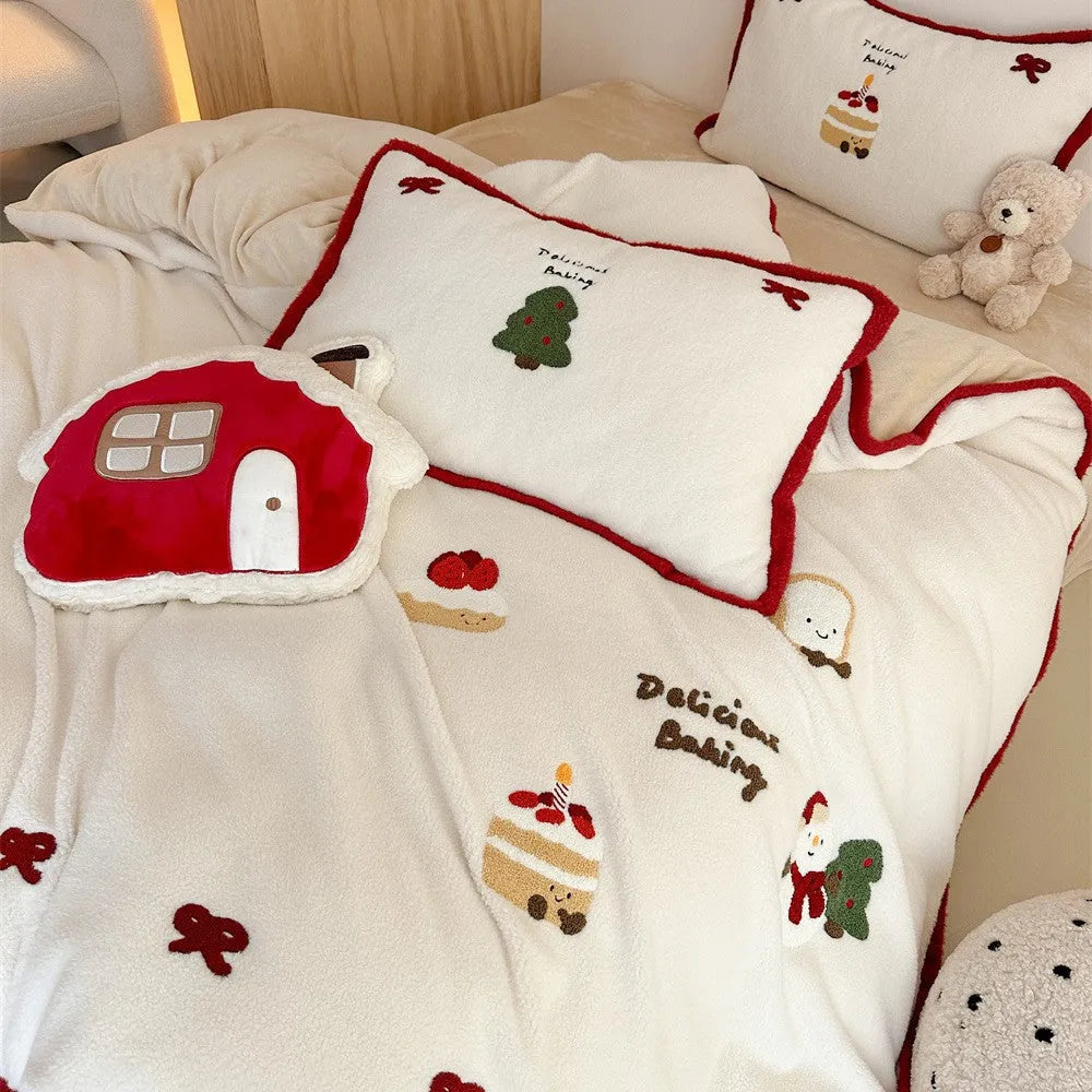 Winter Christmas cartoon patterned bed linen four-piece set on a bed, showing duvet cover and pillowcases.