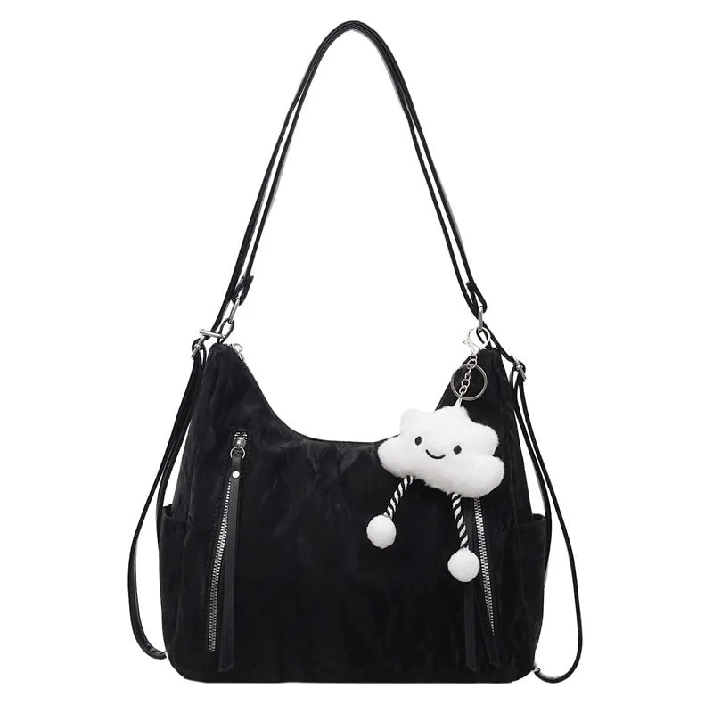 Women's soft PU fashion backpack in blue colour with pendant accessory attached