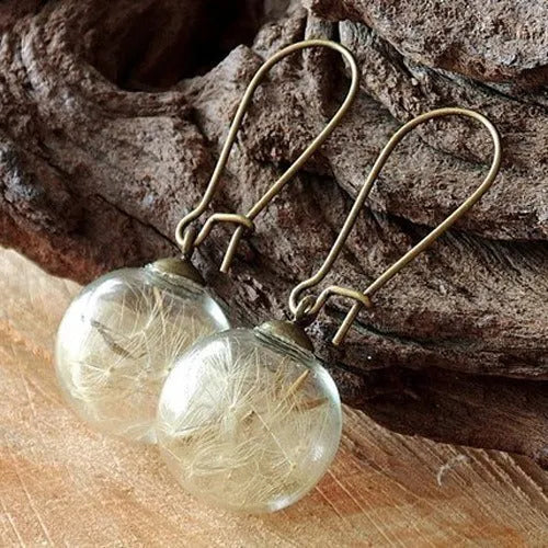 Transparent glass ball earrings with dandelion seed design on silver French hooks
