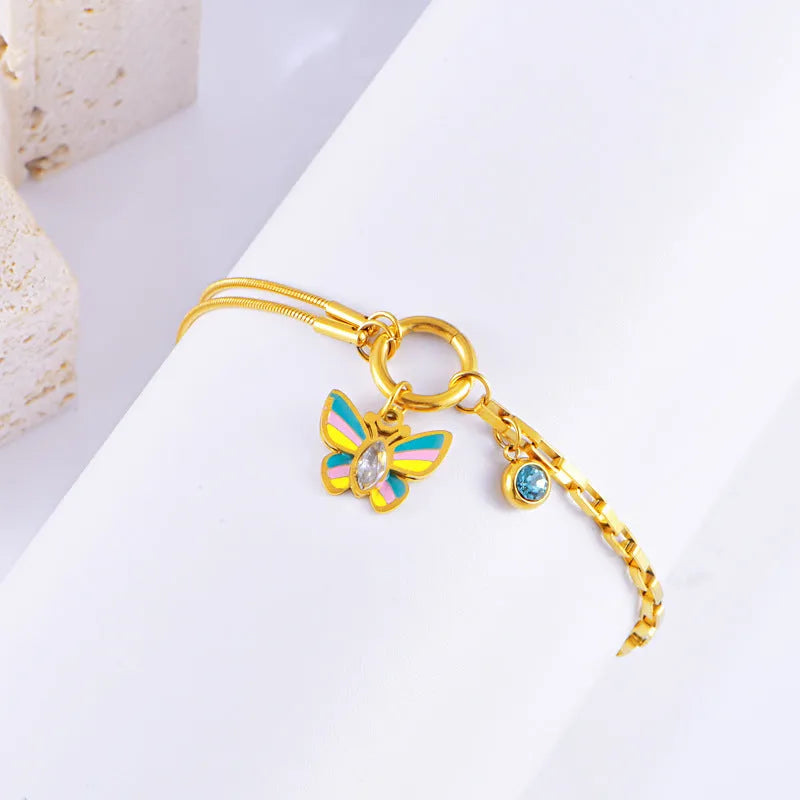 Gold epoxy butterfly necklace and bracelet set with titanium steel construction and zodiac animal pendant