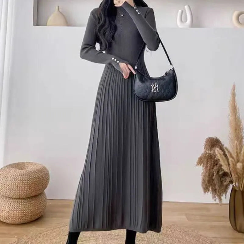 A women's solid colour A-line woollen skirt with a high waist, shown in a mid-length below-the-knee cut.