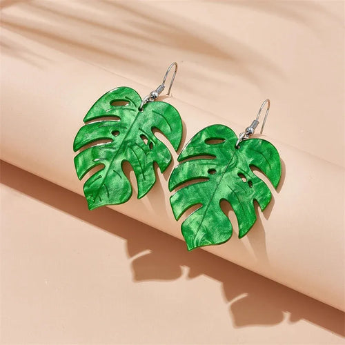Acrylic drop earrings with a carved coconut and jackfruit design on a metal hook, shown in multiple colour variants.